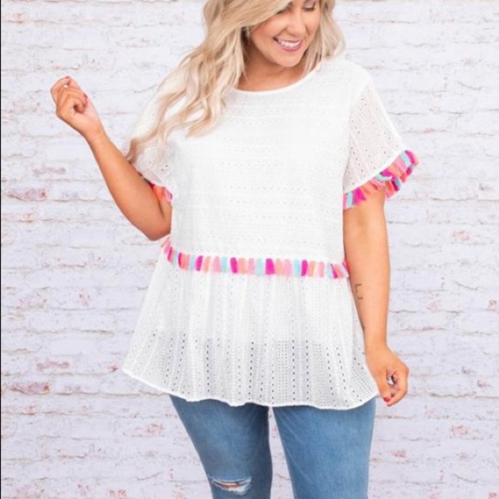 Poms Away top with a free bracelet